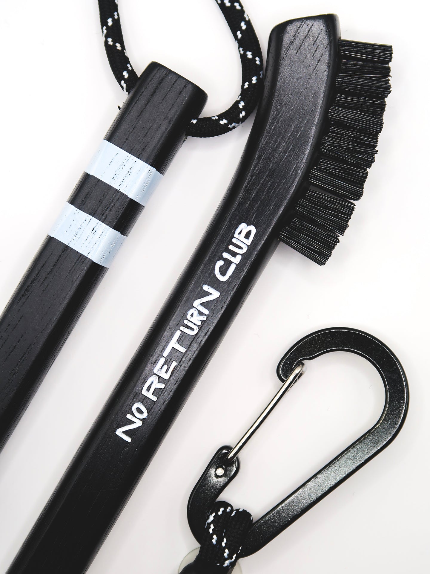 Hickory wood handle of premium golf club brush showing natural wood grain and engraved detailing.